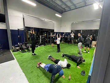 Coach-led group training session on the turf at Better Baseball Training El Dorado Hills